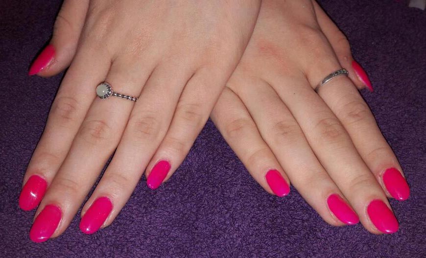 hands with long pink nails