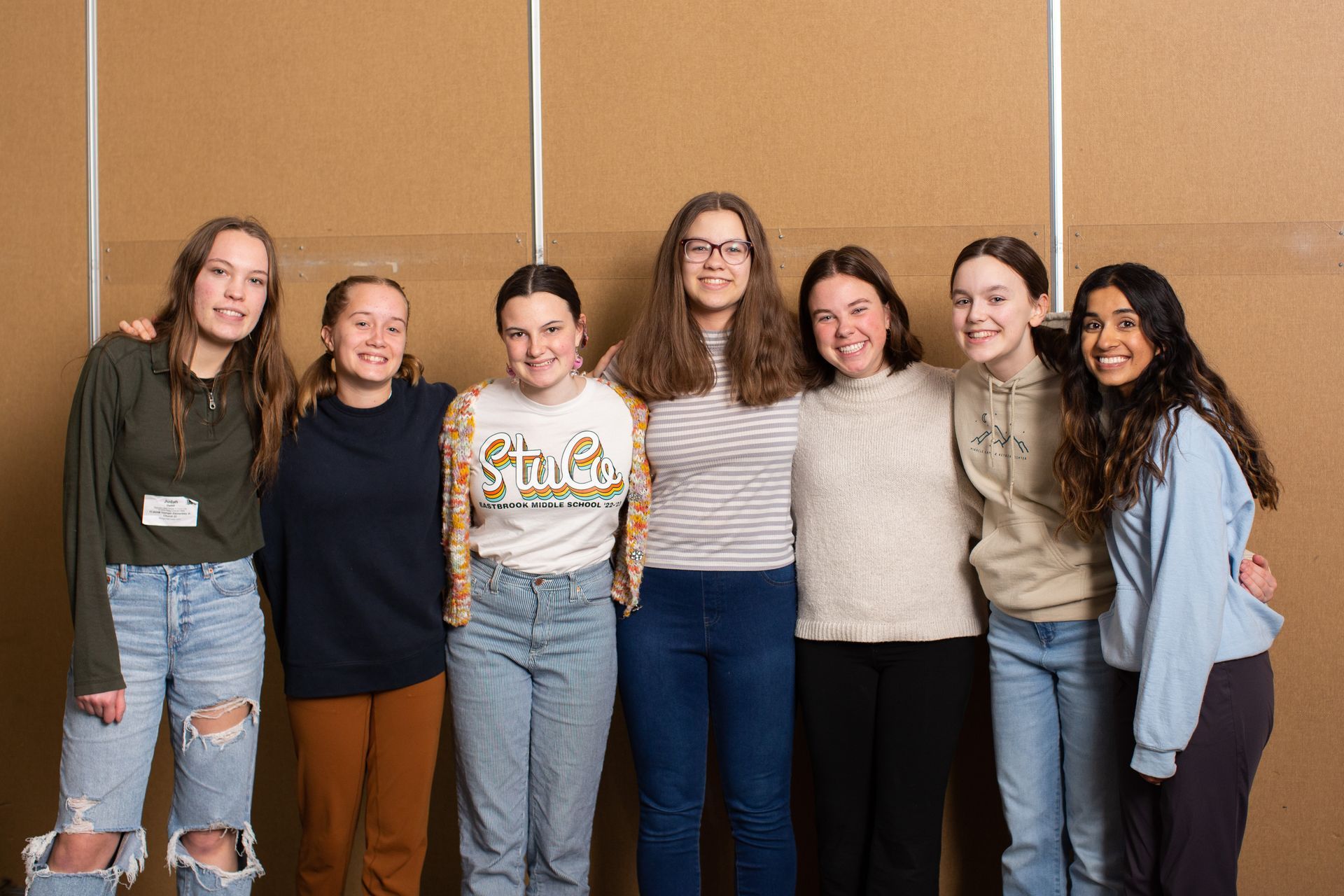 a group of young women are posing for a picture together .