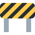 A yellow and black striped construction barrier on a white background.