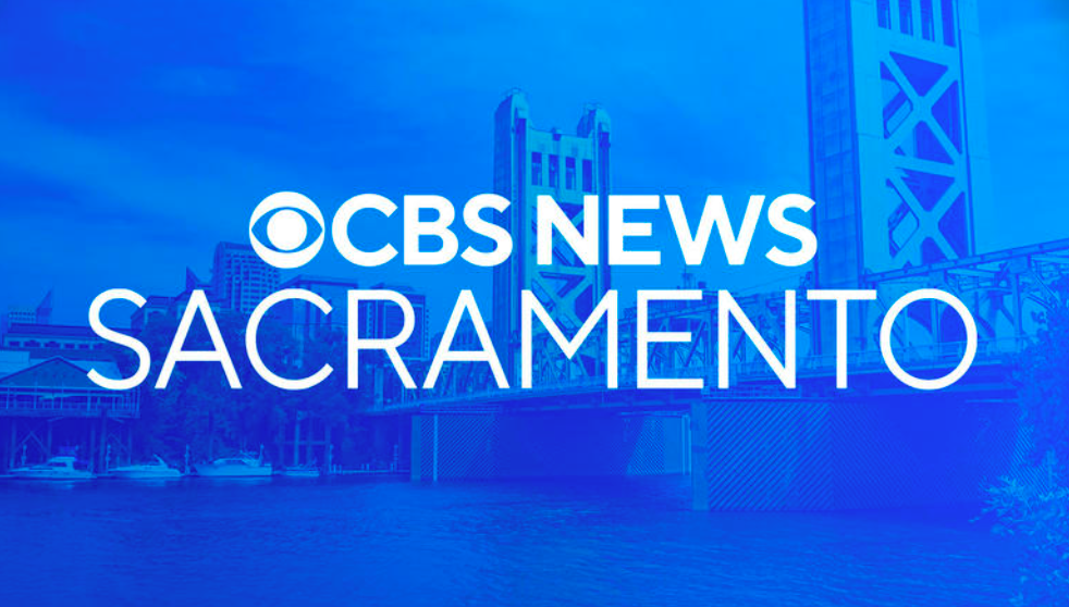 A blue background with the words `` cbs news sacramento '' on it.