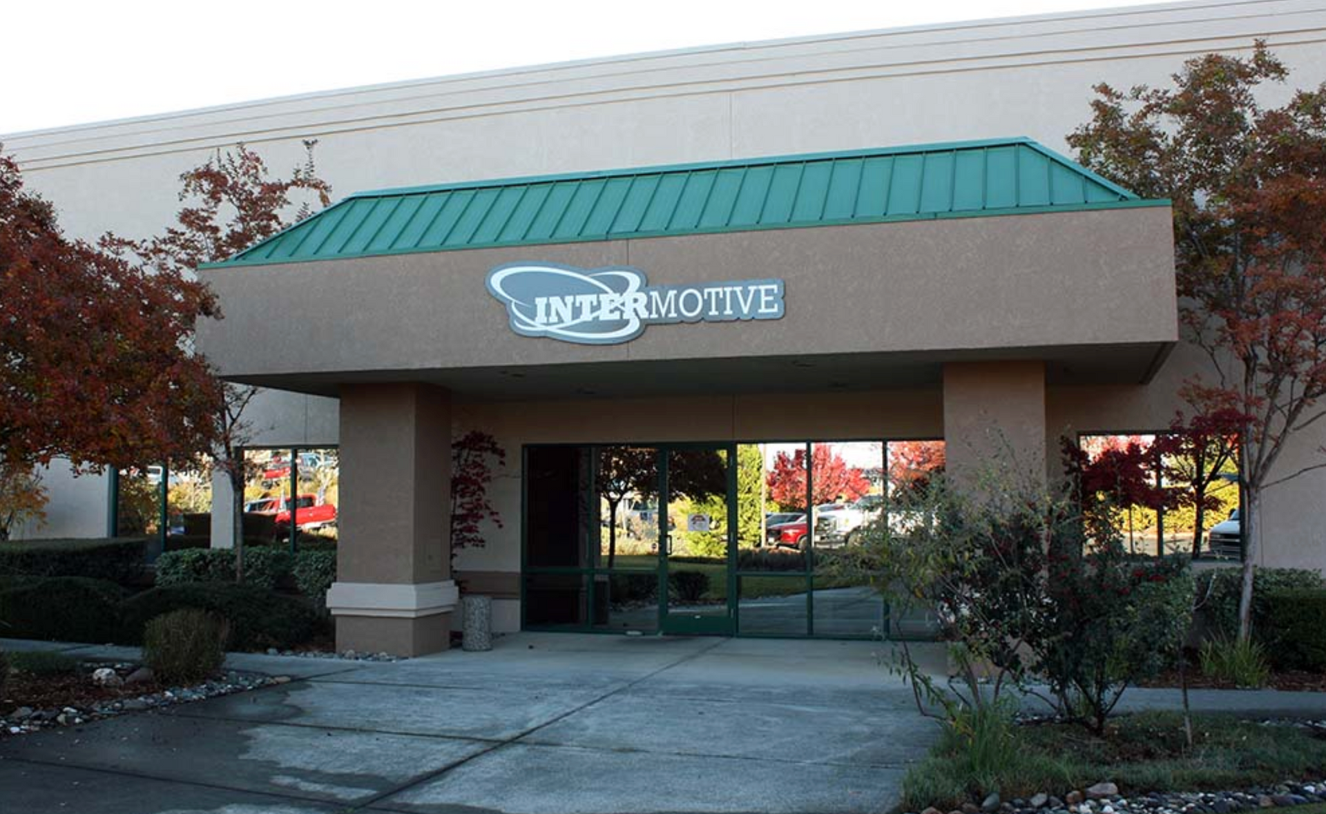 A building with a green roof and a sign that says interactive