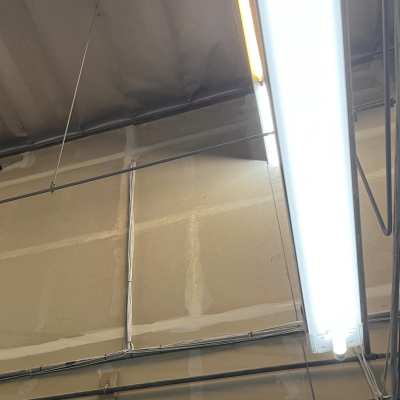 A light is hanging from the ceiling of a building