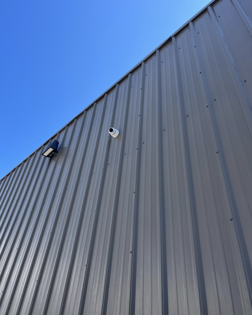 A gray building with a blue sky in the background