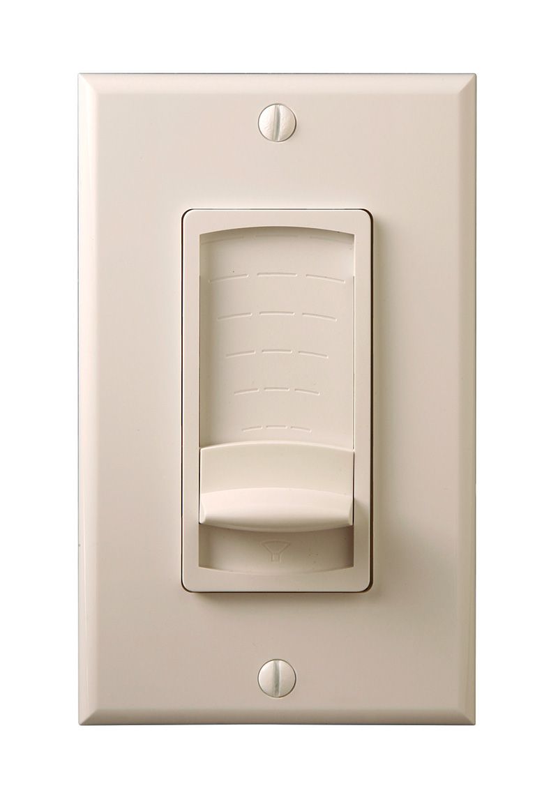 A white light switch on a white wall.