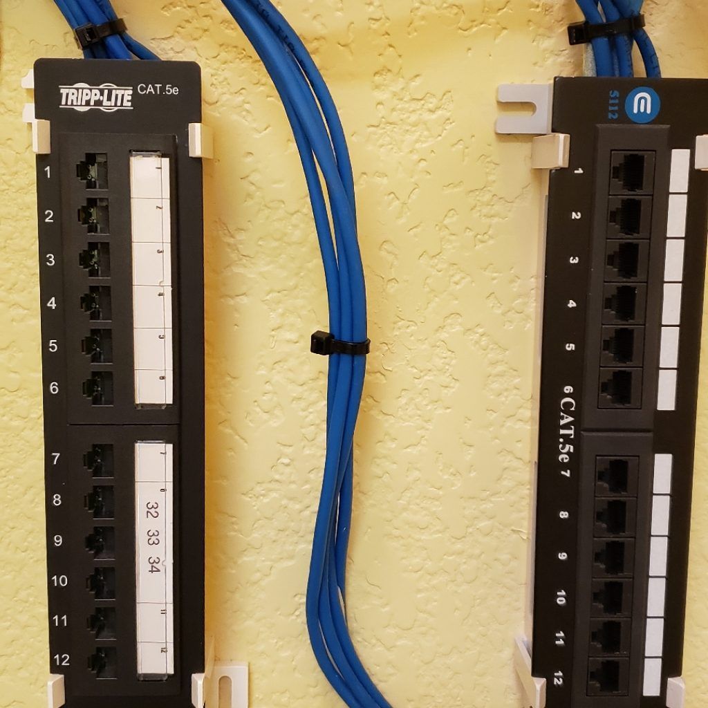 Two tap-lite boxes with blue wires attached to them