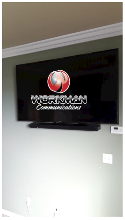 A workman communications television is mounted on a wall