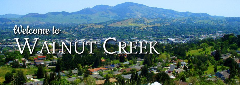 An aerial view of walnut creek with mountains in the background