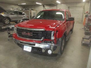 Damaged Red GMC Truck | Faribault, MN | Midwest Collision