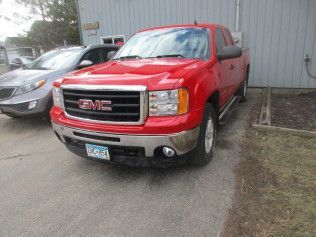 Damaged Red GMC Truck After Repair | Faribault, MN | Midwest Collision