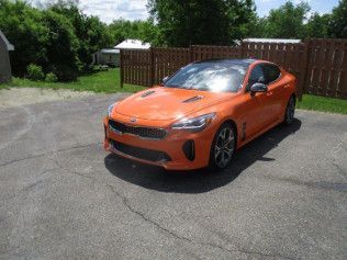 Damaged Orange Car After Repair | Faribault, MN | Midwest Collision