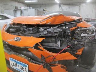 Close Up Of A Damaged Orange Car | Faribault, MN | Midwest Collision
