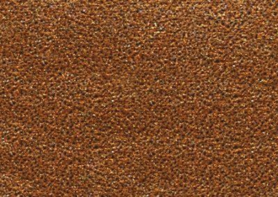 A close up of a brown glittery surface.