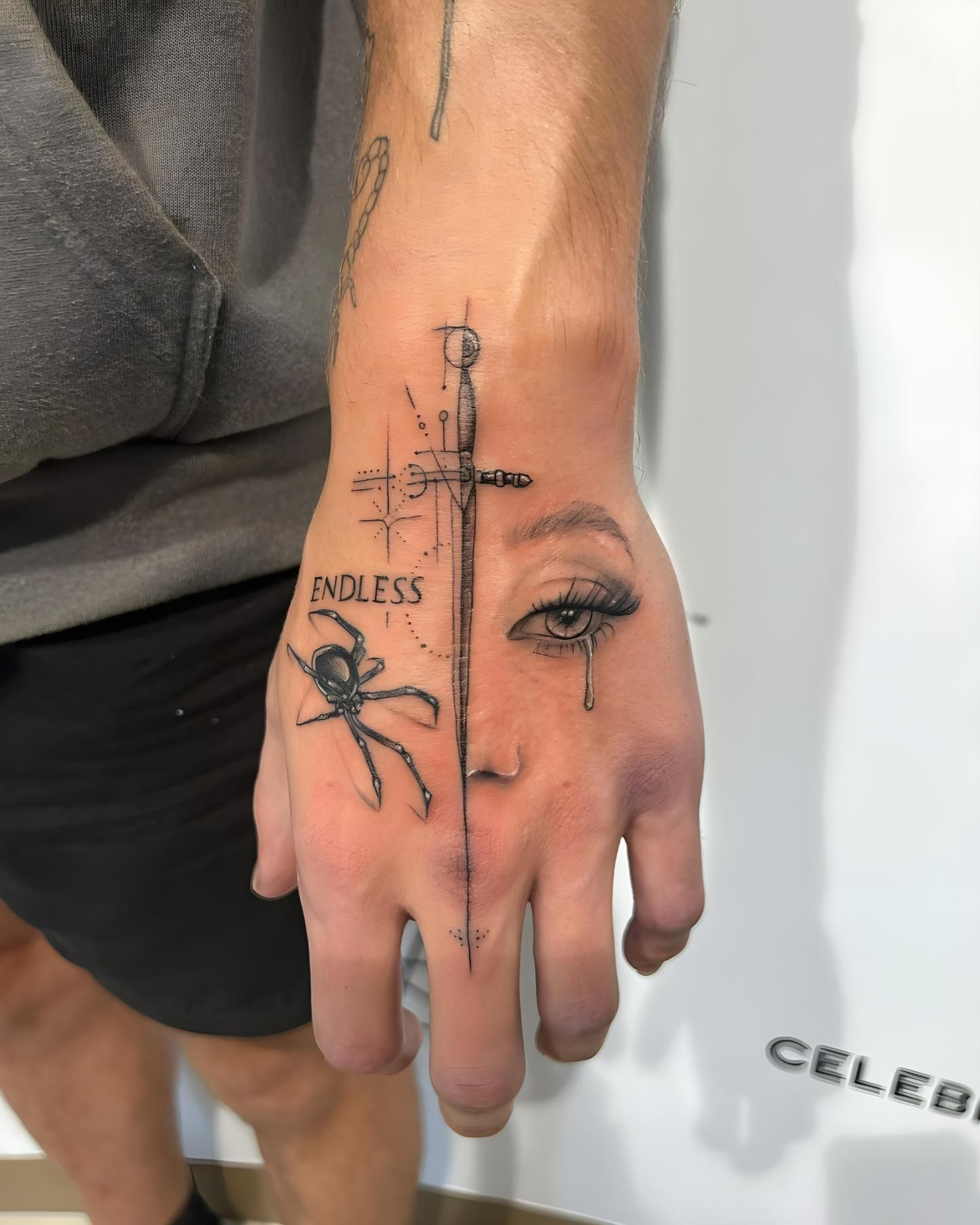 A Man Has an Endless Tattoo on His Hand — Tattoo Inc Studio in Burleigh, QLD