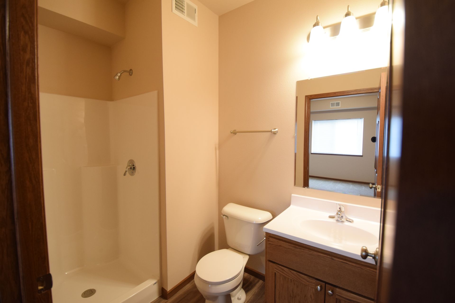 a bathroom with a toilet a sink and a shower