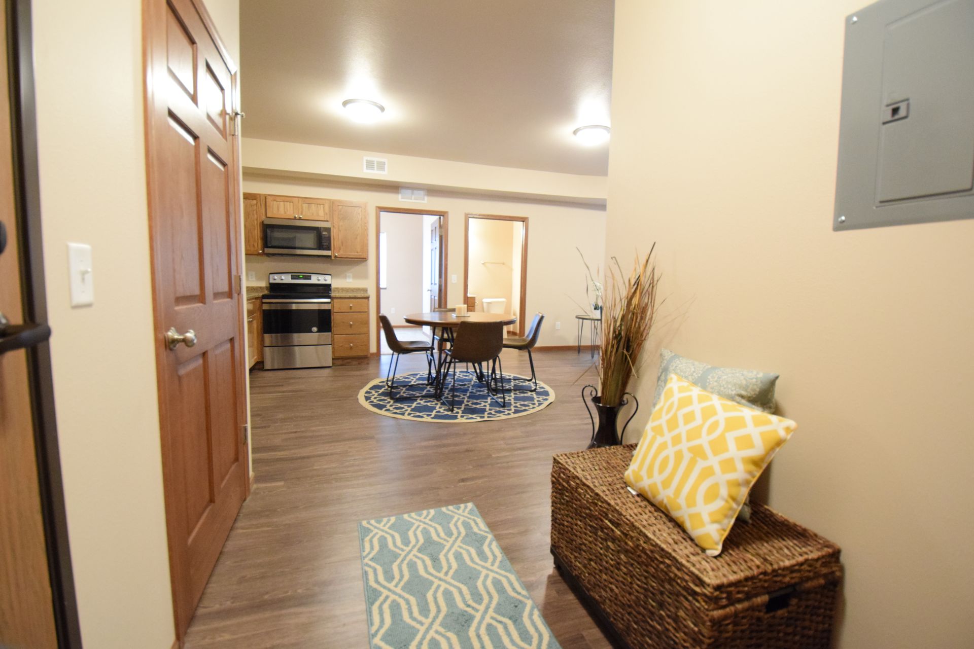 a living room with a table and chairs in it