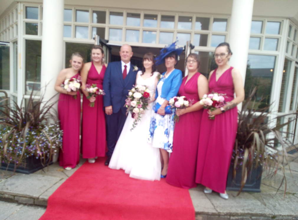 Newly wed couple and bridesmaids