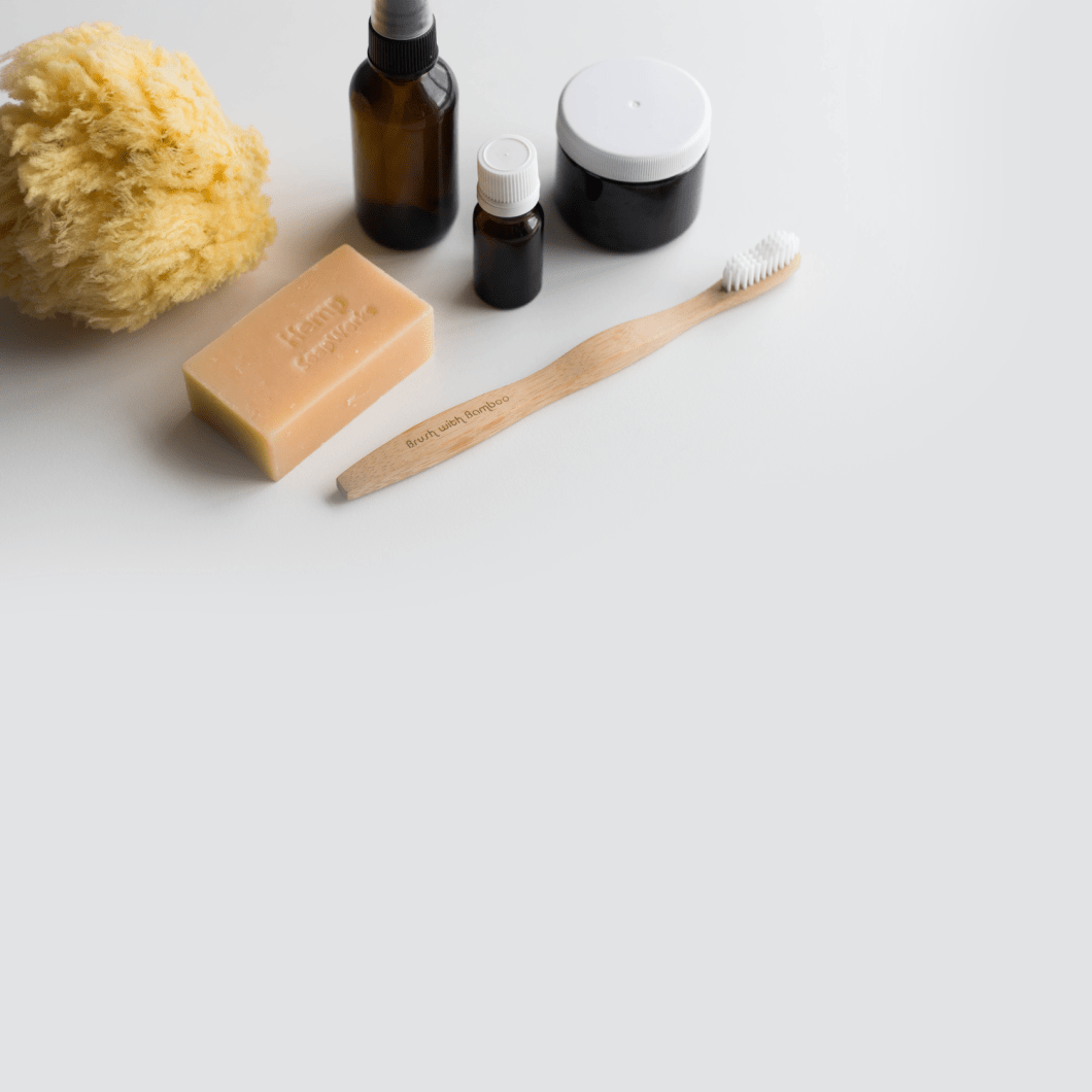 A tooth brush and a bar of soap sit on a table