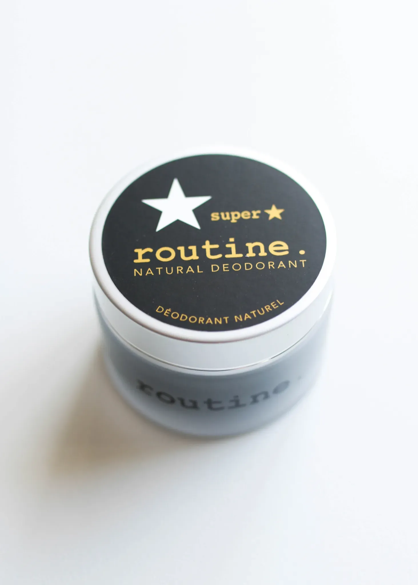 A container of Routine Natural Deodorant