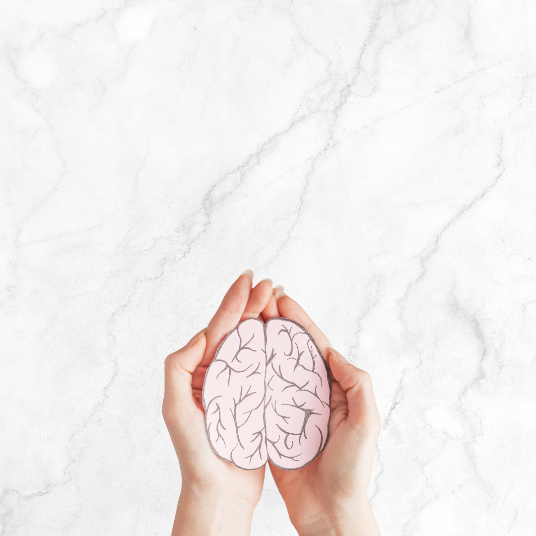Hands holding photo of a brain
