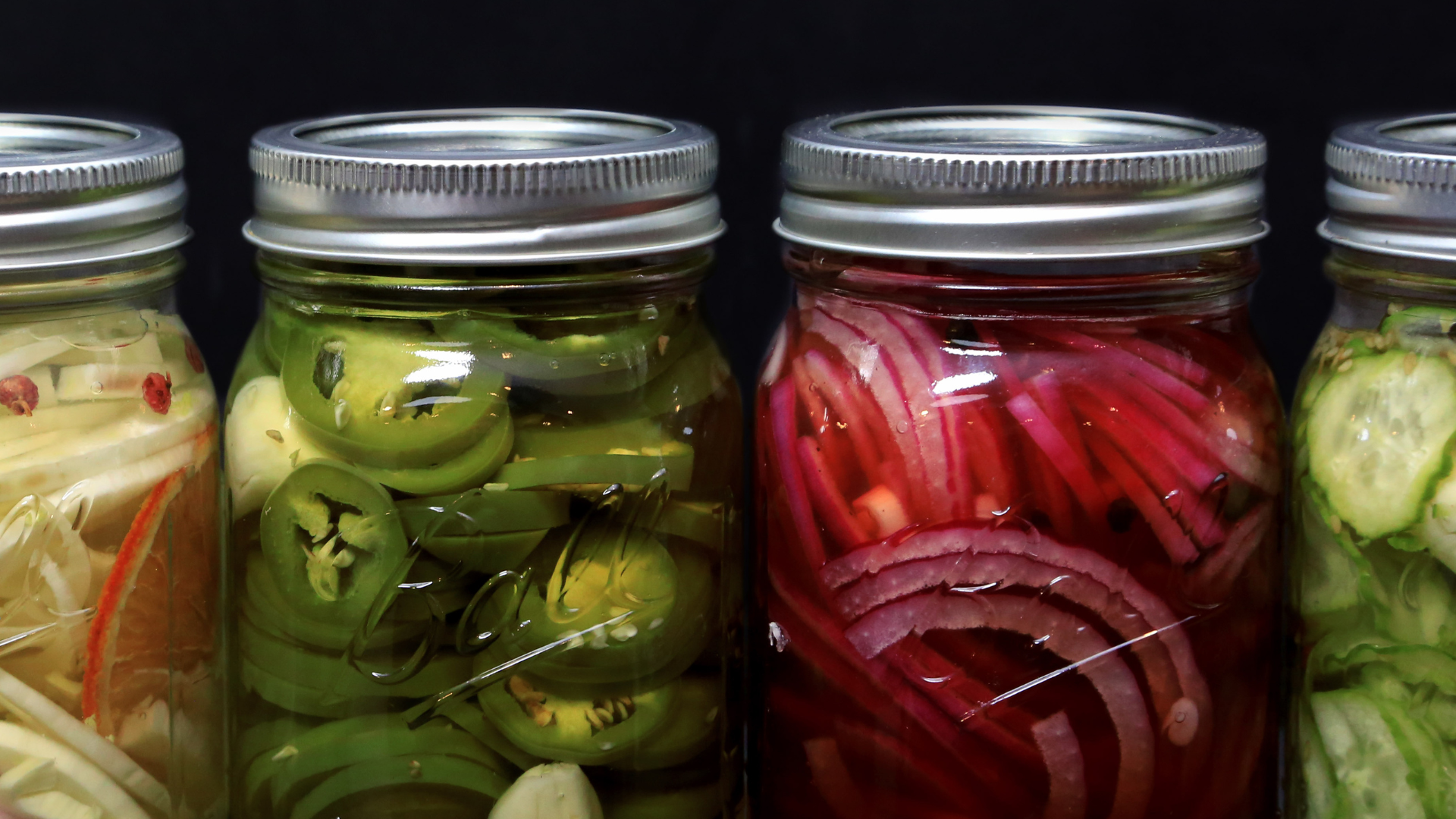 various pickled vegetables in mason jars