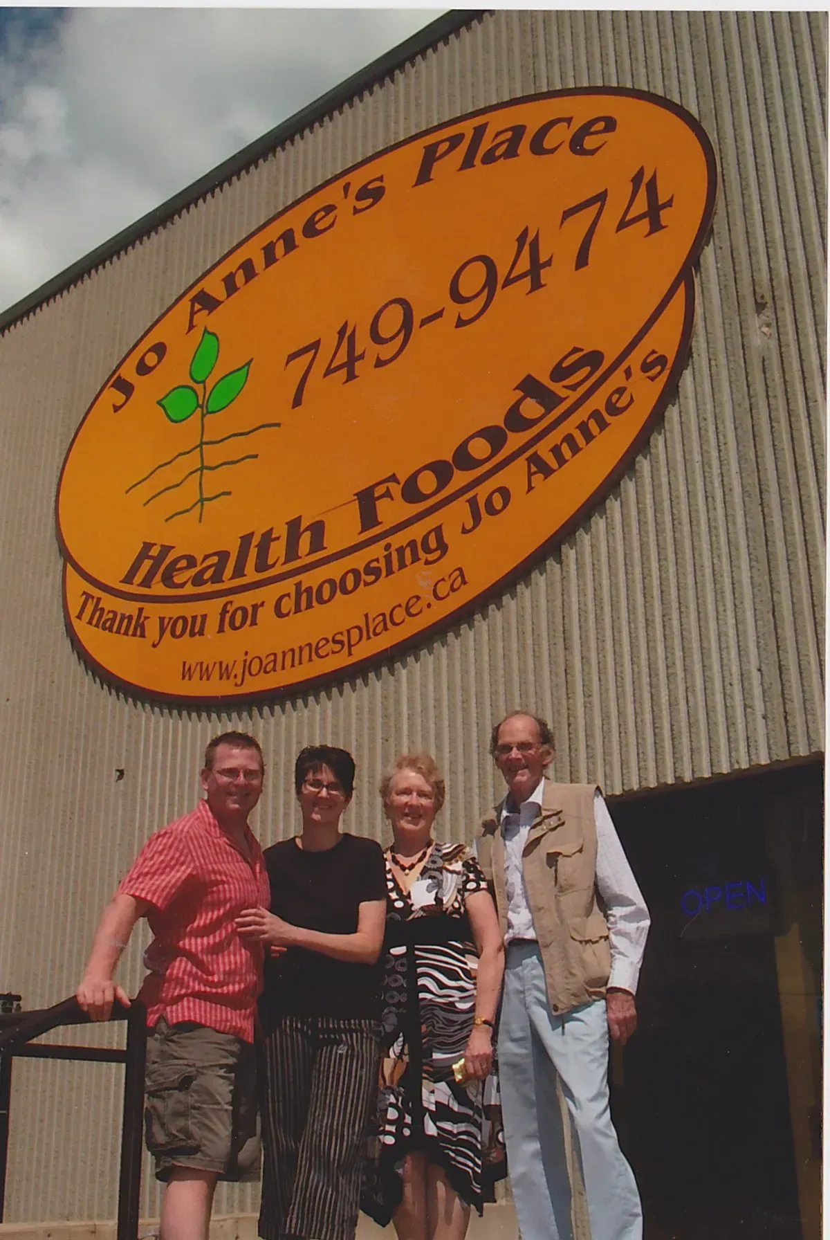 An old photo of the owners of Jo Anne's Place Health Foods outside a previous location