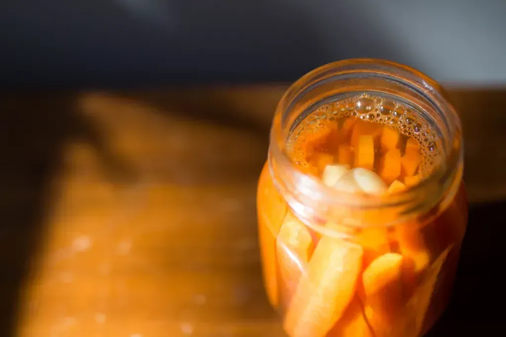 pickled carrots in a glass mason jar