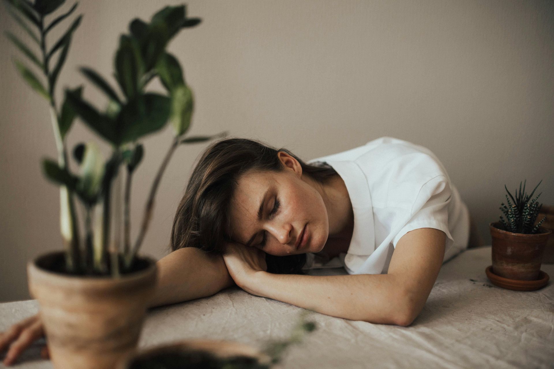 woman asleep on a table