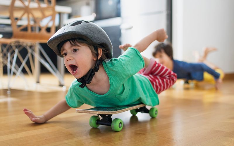 child playing on a skateboard