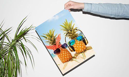hand holding a pineapple poster