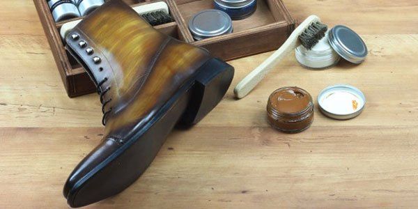 boots next to shoe cleaning kit