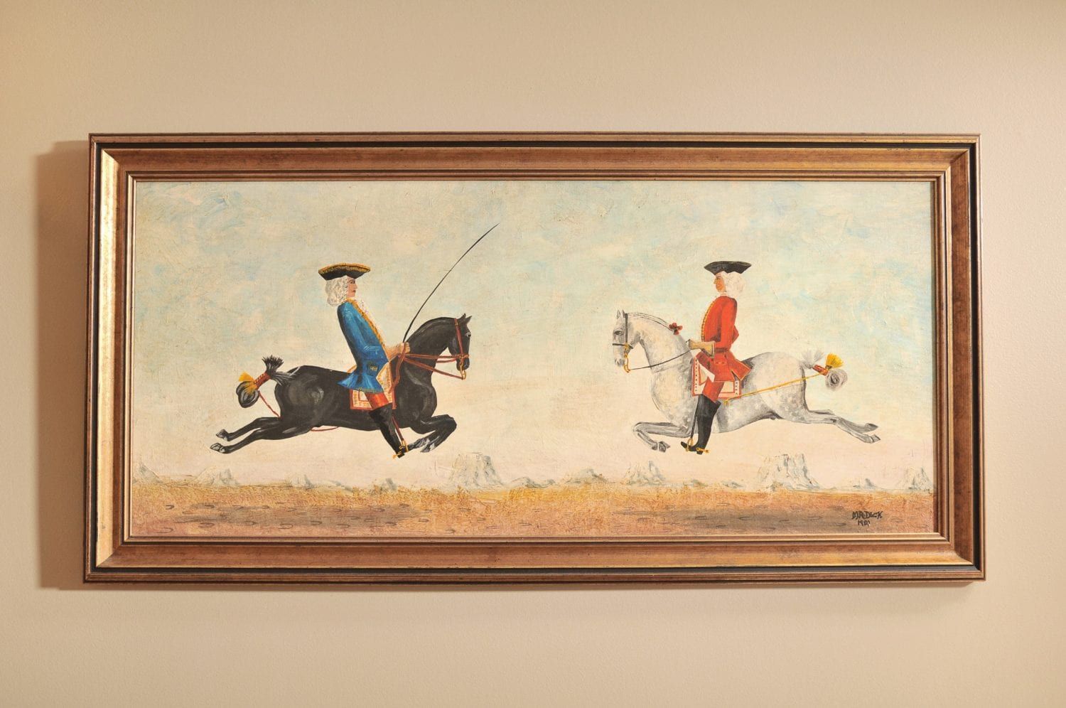 A painting of two men riding horses on a wall