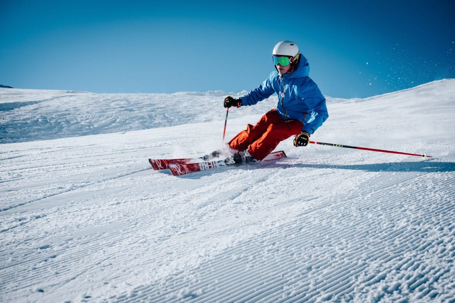 A person is skiing down a snow covered slope.
