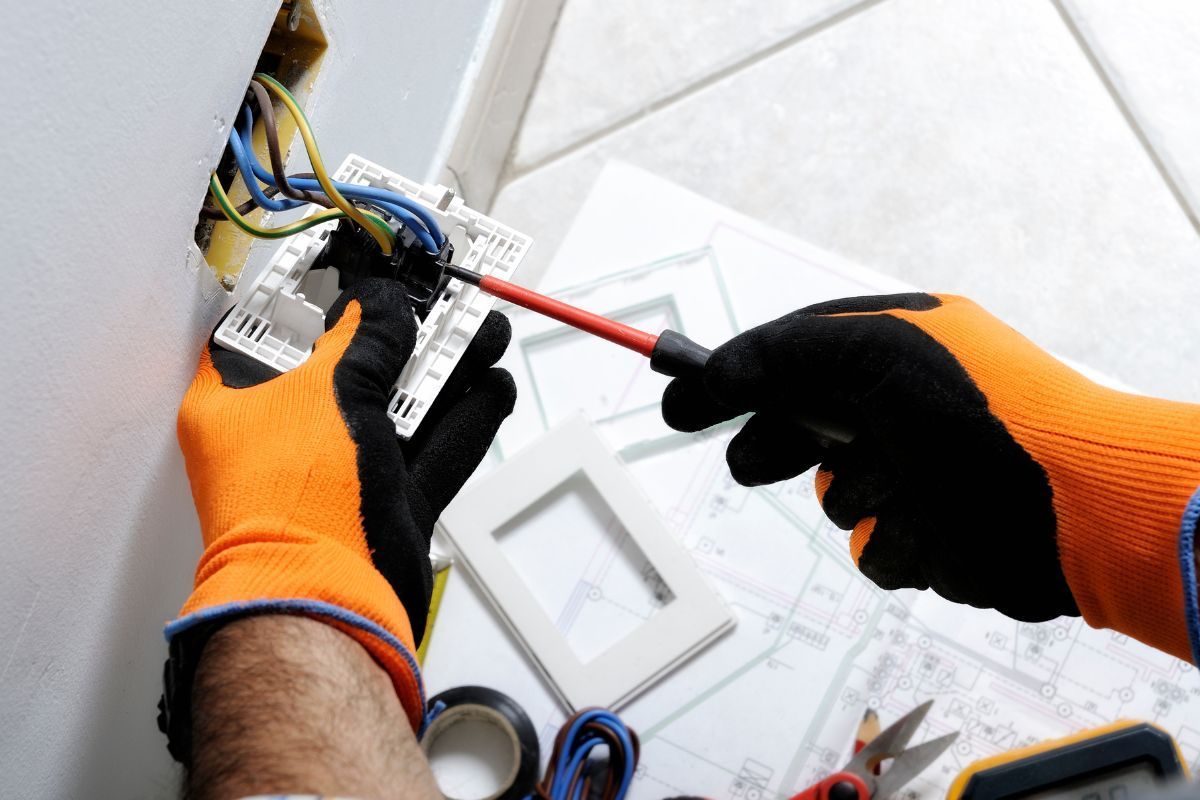 Electrician tightening wires
