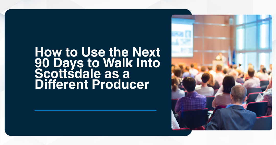 Audience seated at a professional conference facing a presenter on stage.
