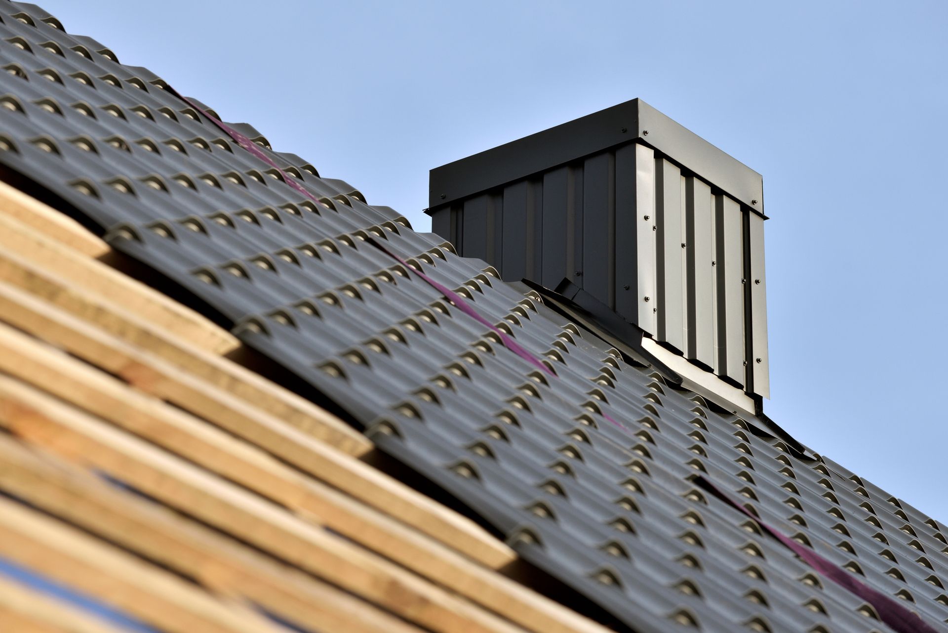 A roof with a chimney on it is being built