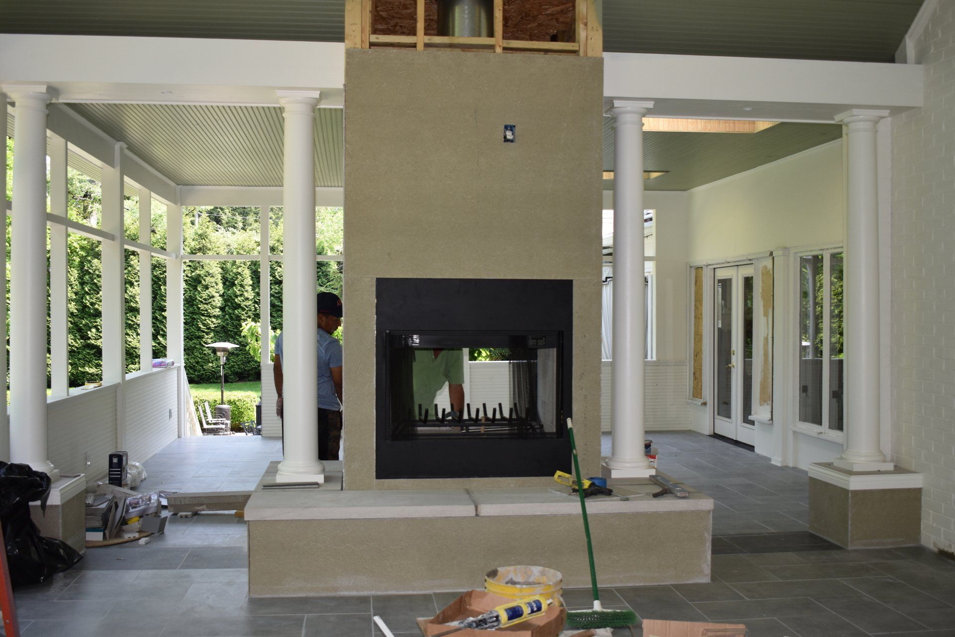 A fireplace is being built in the middle of a room