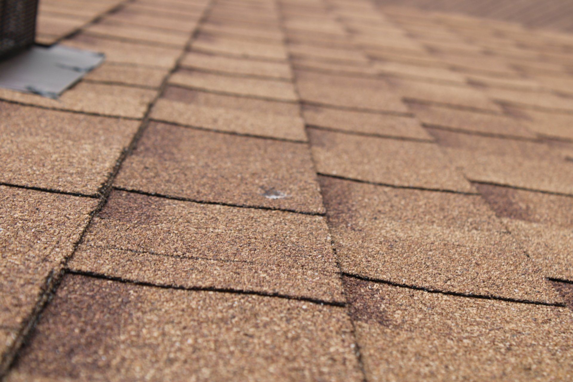 A close up of a roof with a hole in it.
