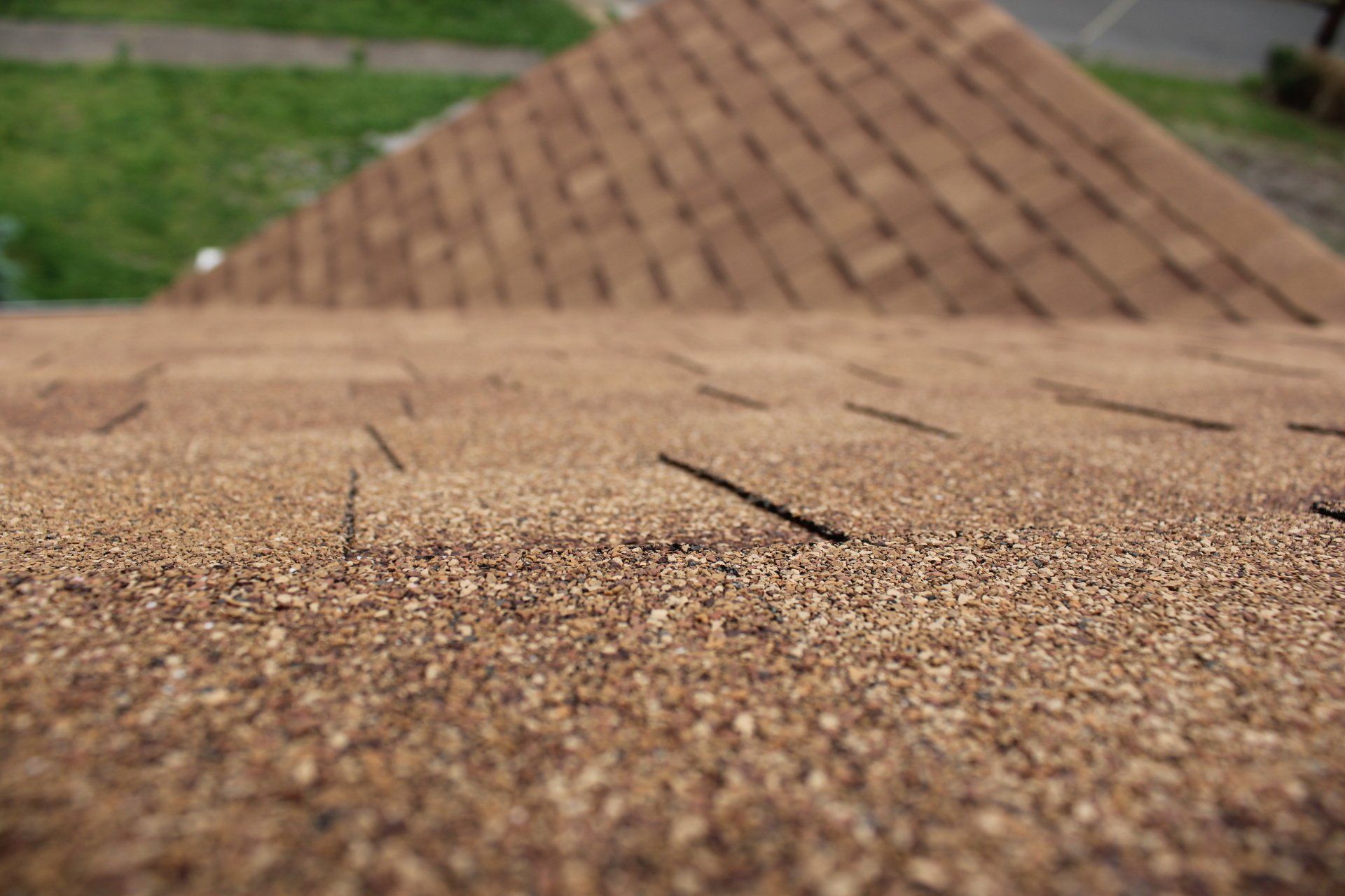 A close up of a roof with a lot of shingles on it.