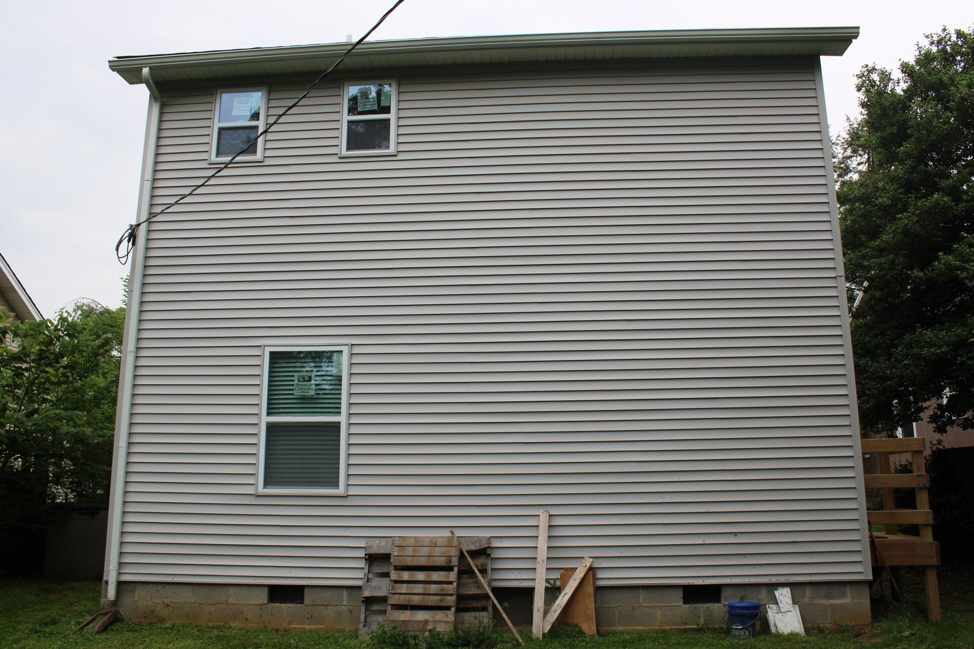 The back of a house with a lot of windows