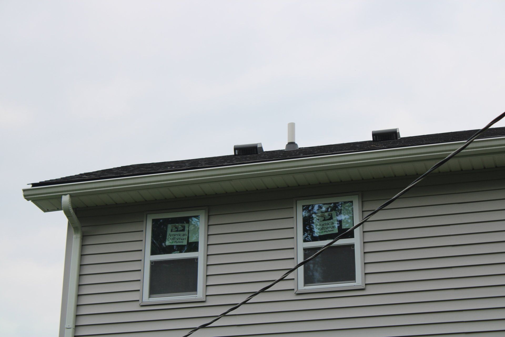 A house with a roof that is missing shingles