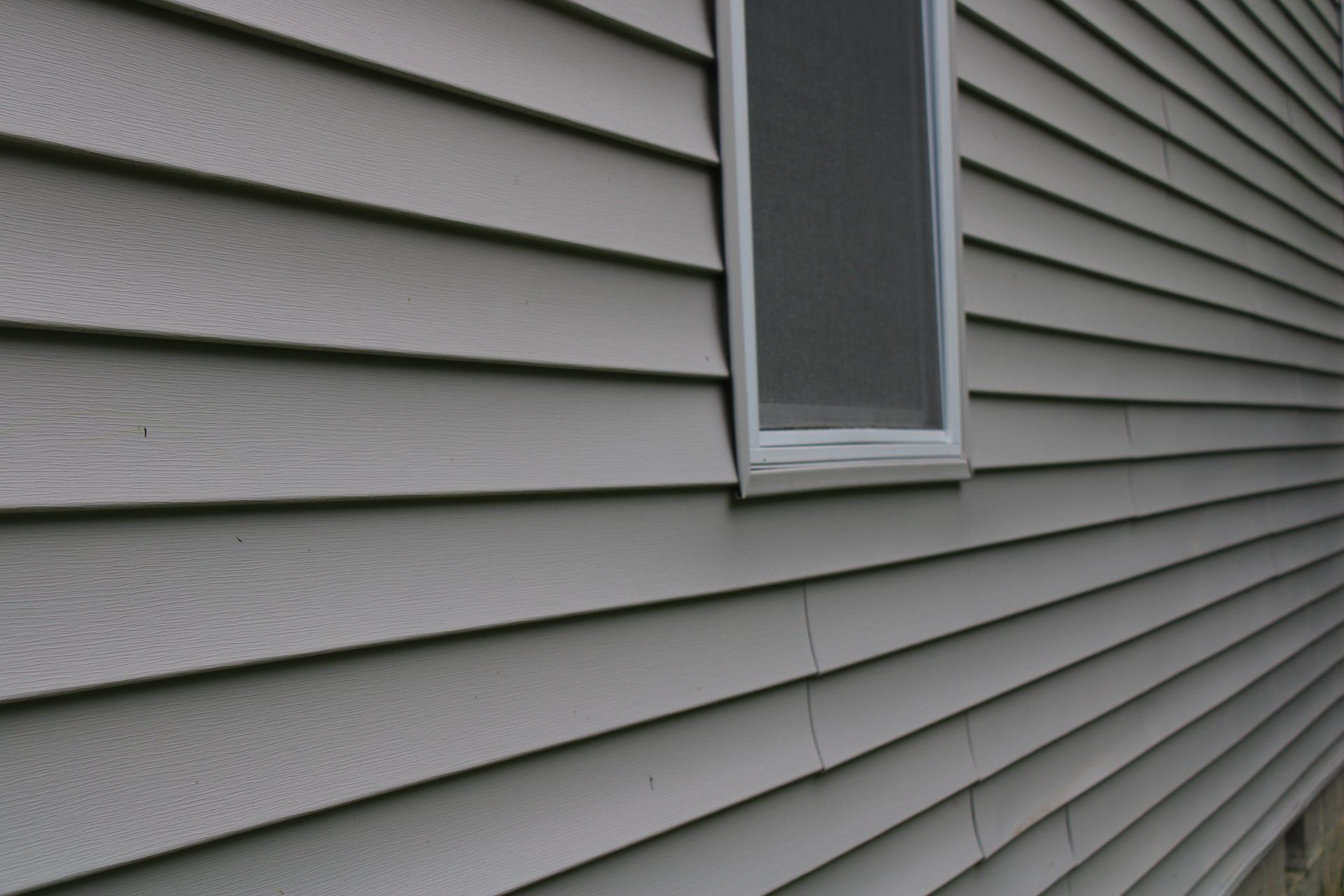 A house with a window on the side of it.
