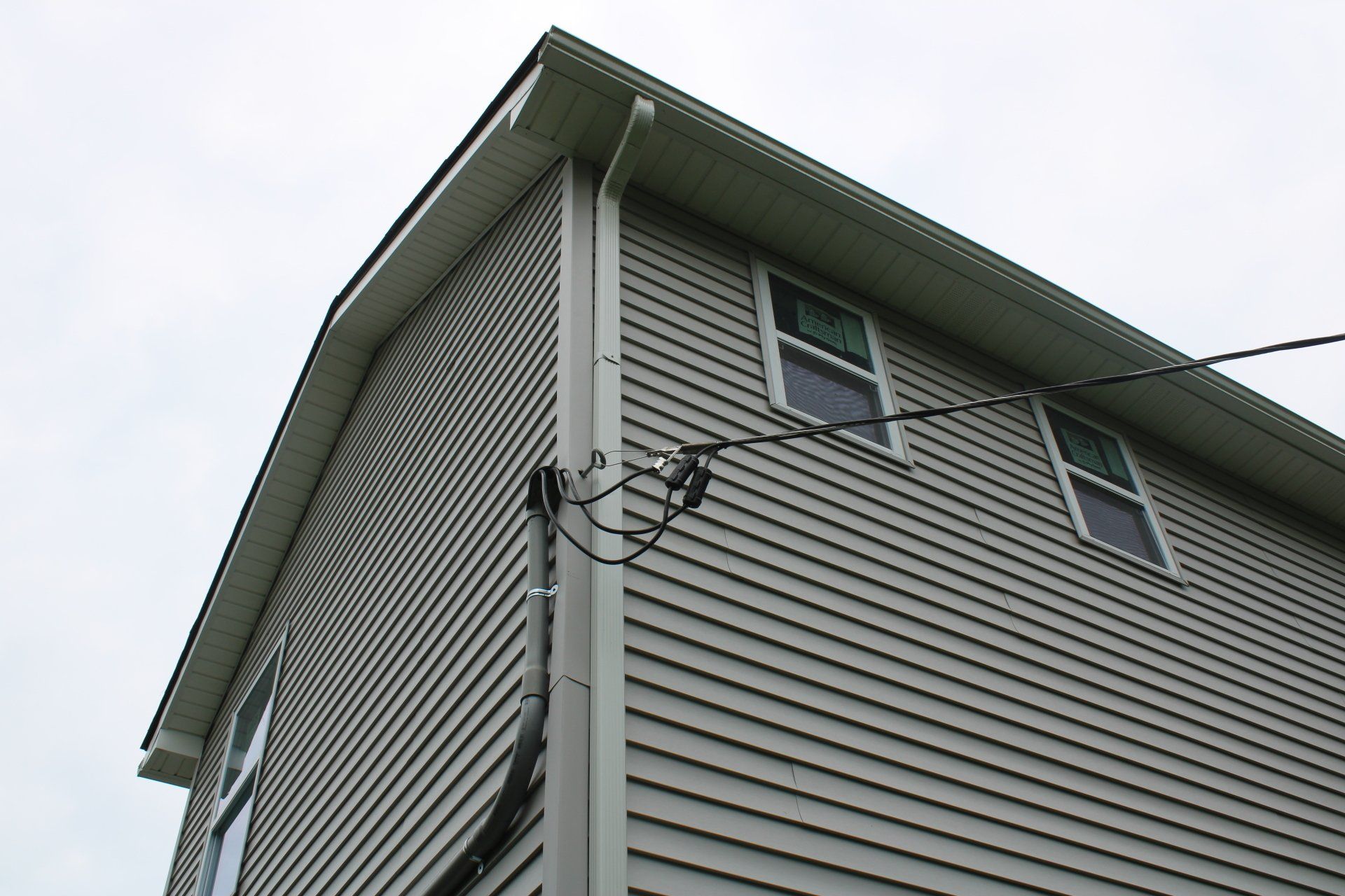 Looking up at a house with a lot of windows