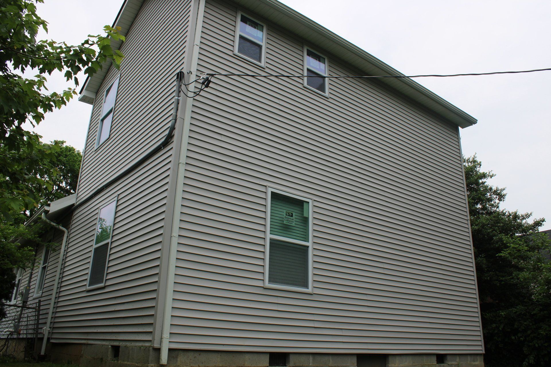 The side of a house with a lot of windows