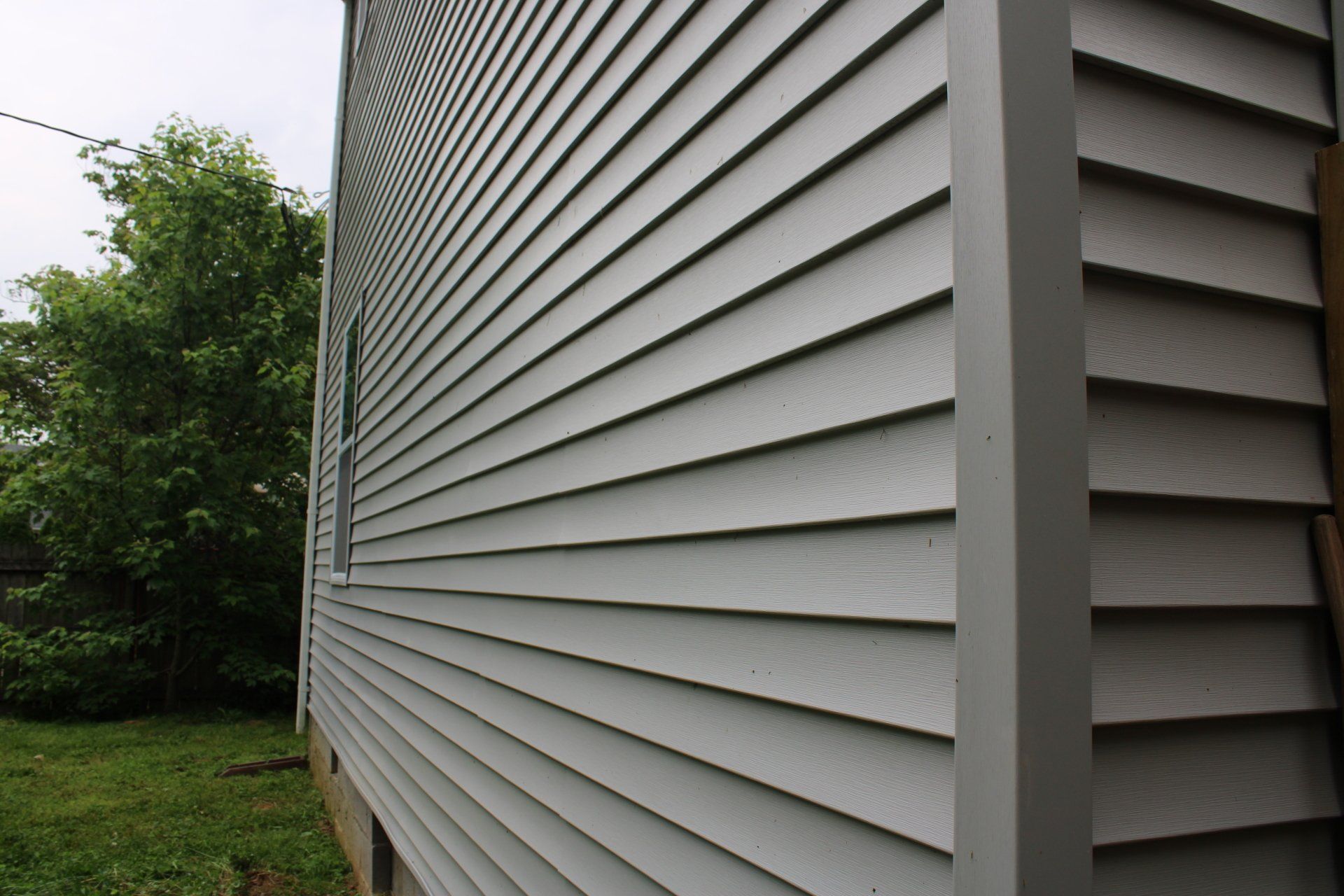 The side of a house with a lot of siding on it