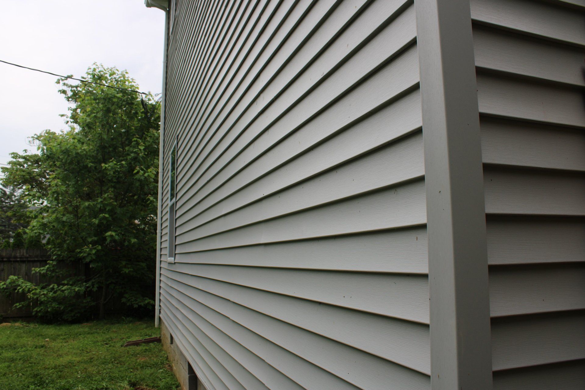 The side of a house with a lot of siding on it
