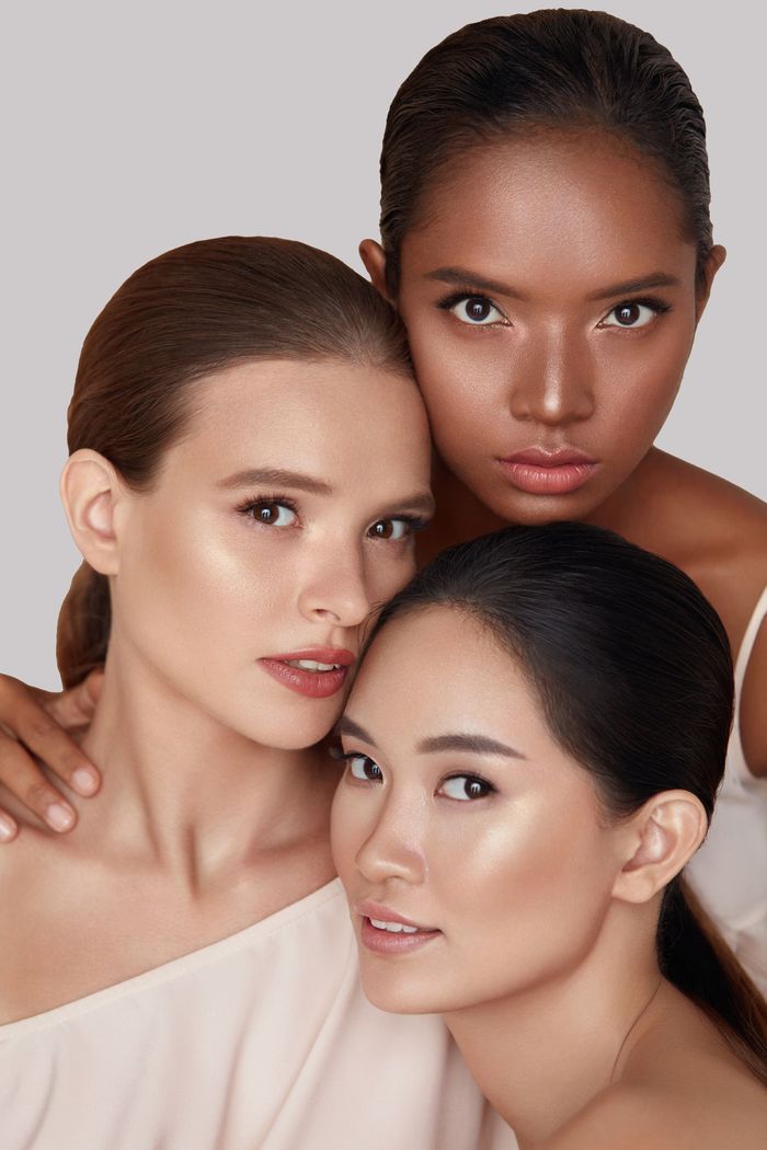 Three women posing for a picture together.