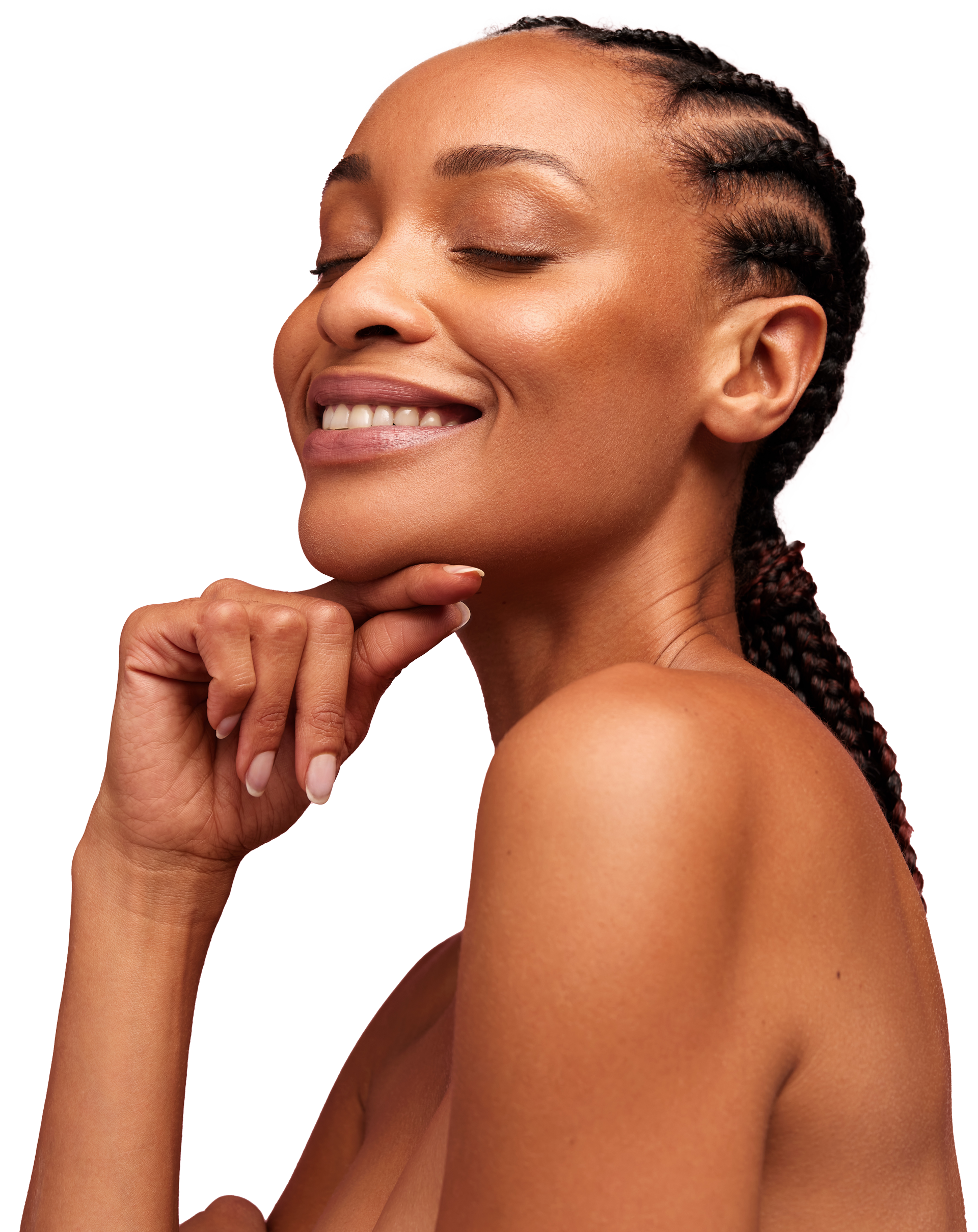 A woman with braids is smiling with her eyes closed