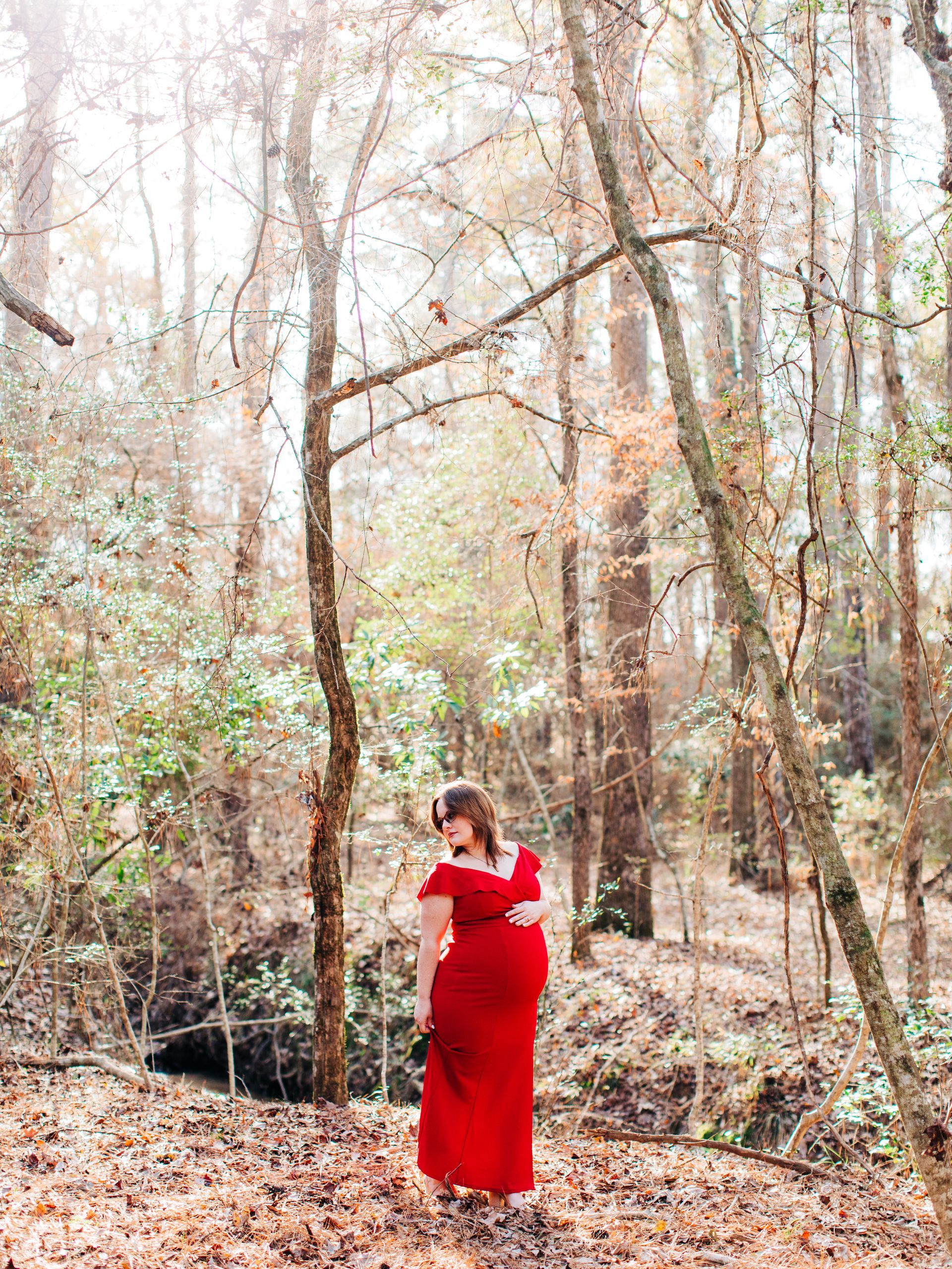 A Pregnant Woman Posing In The Woods