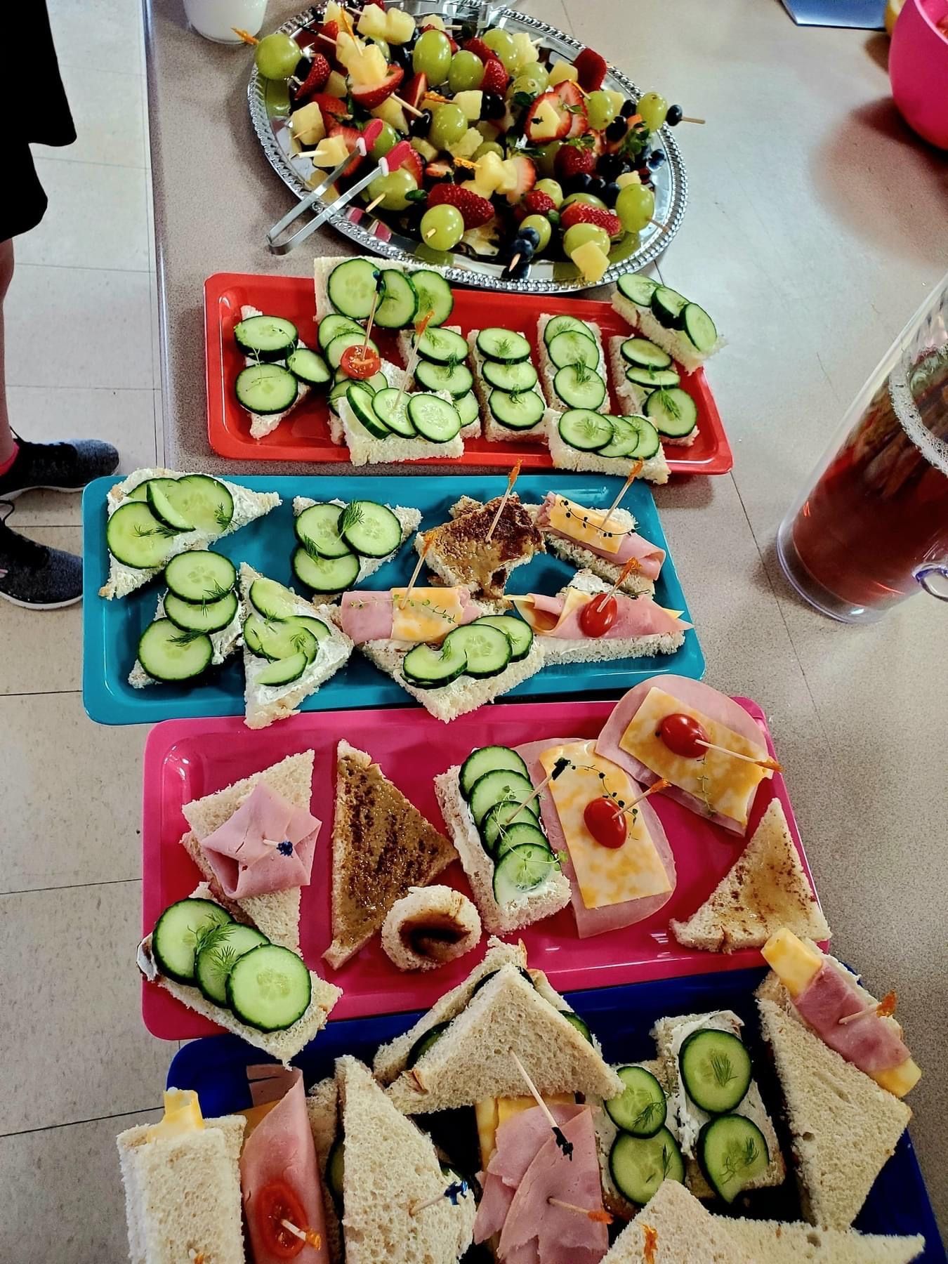 Tea sandwiches, fruit kabobs, strawberry. hand pies, punch or ice tea