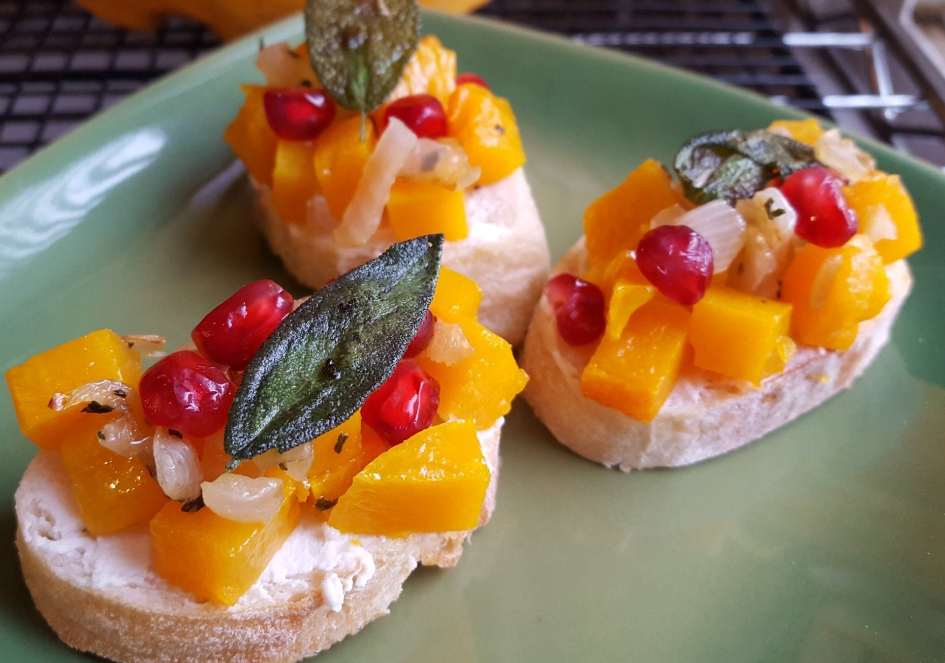 Squash, sage and pomegranate crostini